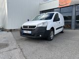 a picture of a white van parked in front of a building