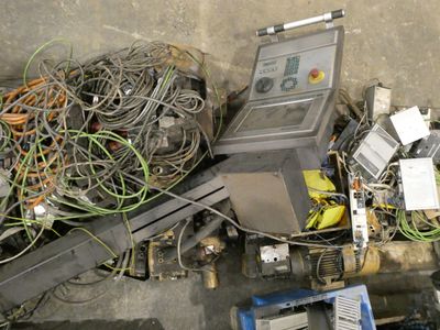 an overhead view of a pile of wires and equipment on the ground