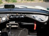 a steering wheel and dashboard of a car with a cell phone in it