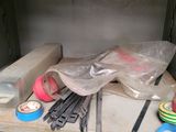a shelf that has some tools on top of it