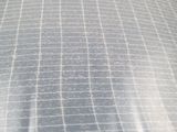 a bed that has a sheet of plastic covering it