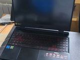 a laptop computer sitting on top of a wooden desk