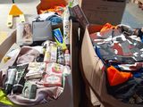 many boxes of clothing and other items in a warehouse