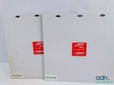 two white boxes with red labels on them sitting next to each other