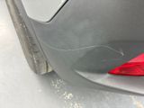 a close up of a car ' s bumper with scratches on it
