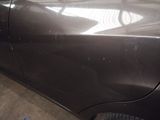a close up of a car with a denting on it