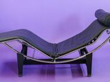 an image of a chaise lounger on a purple background