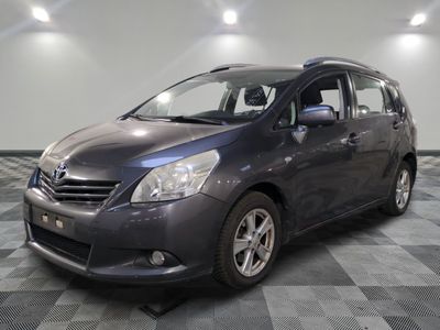 a picture of a gray toyota sienna parked in a garage