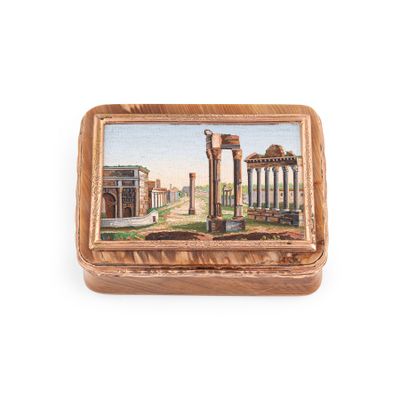 an old wooden box with a painting of a roman city