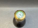 a close up of a bottle of beer on a table