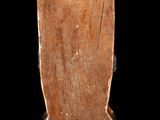 an image of a wooden sculpture of a woman on a black background