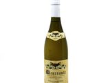 a bottle of wine that is sitting on a table