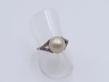 sterling silver ring with a white pearl in the center