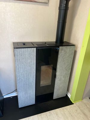 a small stove in the corner of a room