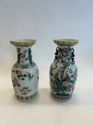 two vases sitting next to each other on a table
