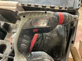 a cordless drill that is sitting in a tool box