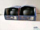 two boxes that have a pair of helmets inside of them