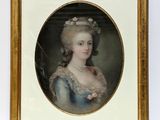 portrait of a lady in a blue dress with a flower in her hair