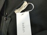 a label on the back of a black jacket