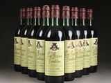 six bottles of wine are lined up in a row