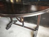 a table that has a bunch of bananas on it