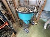 an image of a man working on a grill in a garage