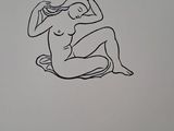 a drawing of a nude woman sitting on the ground