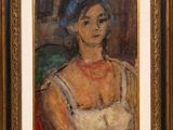 portrait of a woman in a blue hat, seated in a chair