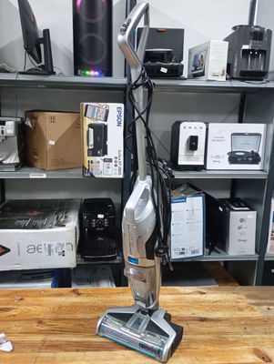 a vacuum that is sitting on a table in a room