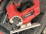 a red corded circular saw in a tool case