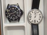 a box with a watch and a belt in it