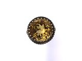 a close up of a yellow sapphire stone on a white background