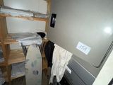 an image of a dirty laundry room with a washer and dryer