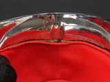 a close up view of a red hat with a metal buckle