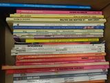 a lot of books in the box on the shelf