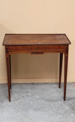 a small wooden table with a drawer on top of it