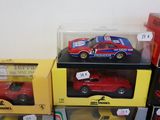 several toy cars are stacked on top of each other in boxes
