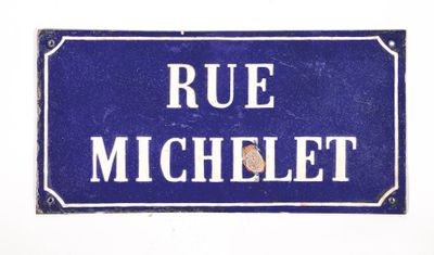 blue and white street sign with the words rue michelet on it