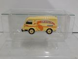 a small toy bus in a clear box on a table