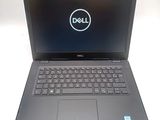 the dell laptop is open and ready to be used
