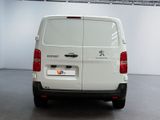 a white van that is parked inside of a building