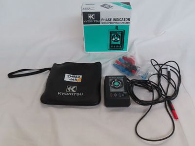 a remote control sitting on a table next to a package