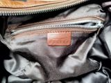 a close up of a purse with a zipper on it
