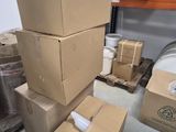 several boxes stacked on top of each other in a warehouse