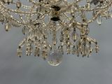 a chandelier made of glass beads hanging from a ceiling