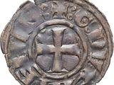 Gros plan sur une pièce de monnaie portant une croix