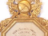 a gold clock with a clock face on it