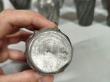 a person that is holding a metal object in their hand