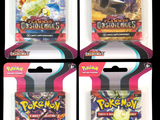 quatre paquets de cartes à collectionner Pokémon dans un emballage en plastique