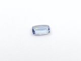 a close up of a blue topazte stone on a white surface
